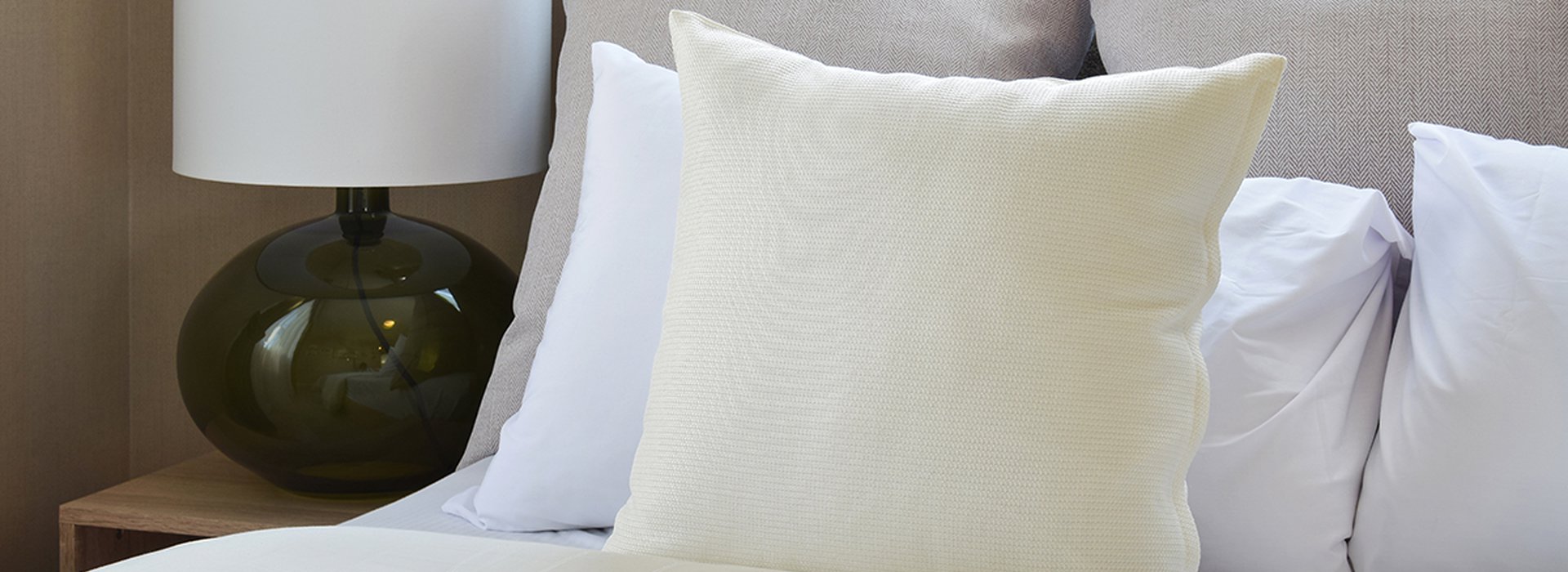 bedroom interior design with white pillows on bed and decorative